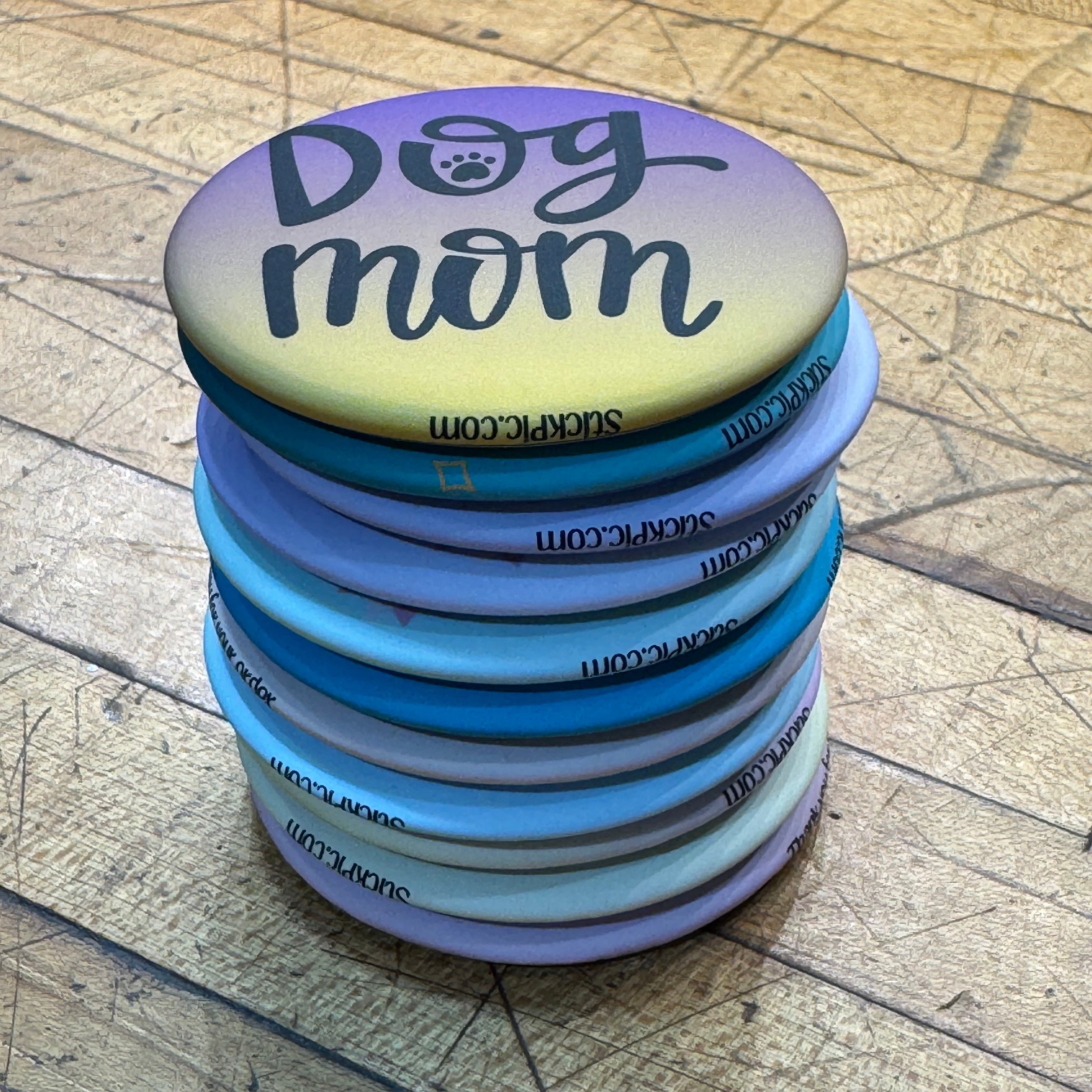 Stack of custom US-made magnetic photo buttons by StickPic